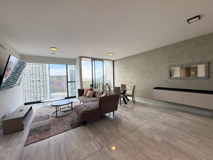 Image of living space with couch in this condo for sale in Nuovo