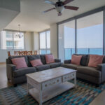 Image of living area with couches and table in this condo for sale in Rio Mar