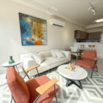 Living room with couch and furniture in this condo for rent in Coco Place