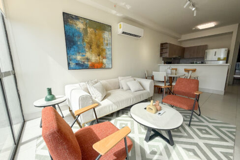 Living room with couch and furniture in this condo for rent in Coco Place