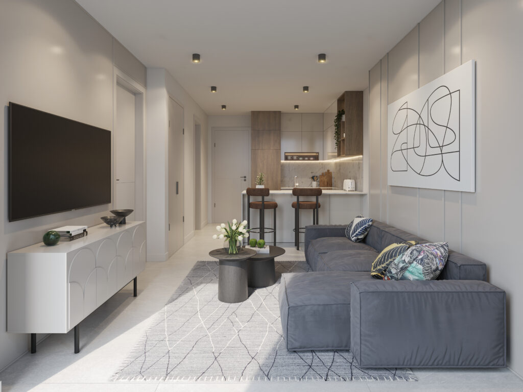 Image of the living room with television and couch in this condo for sale in Alive Art District
