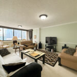 Image of living room with television, couch and table in this condo for sale in Monaco