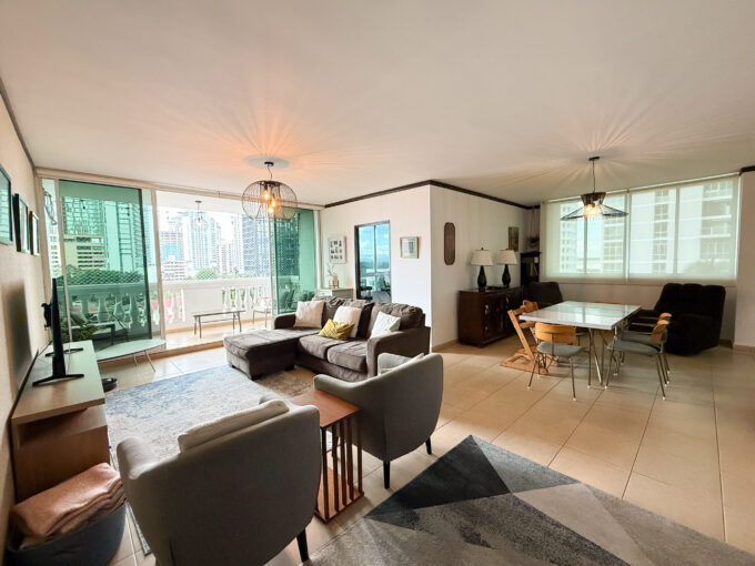 Image of living area with couch and balcony in this condo for sale in Da Vinci