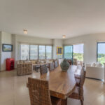 Image of living room with table, chairs and couch in this condo for sale in Vista Mar