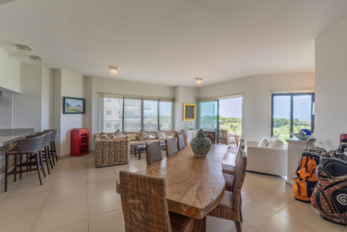 Image of living room with table, chairs and couch in this condo for sale in Vista Mar