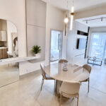 Image of living space with table and chairs in this condo for sale in Ocean House