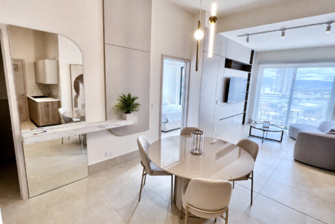Image of living space with table and chairs in this condo for sale in Ocean House