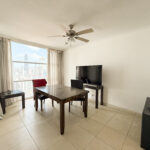 Image of living area with table and chairs in this condo for sale in Solaris