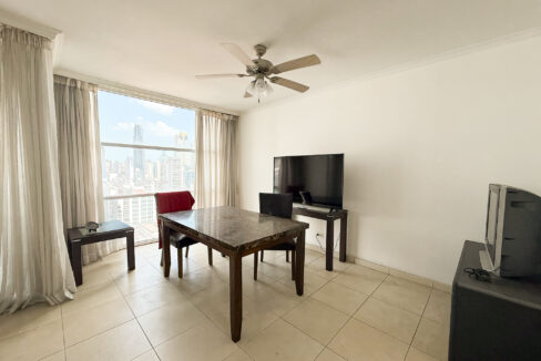 Image of living area with table and chairs in this condo for sale in Solaris