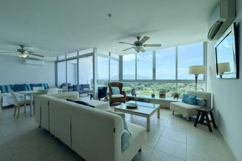 Image of living room with furniture and window in this condo for sale in Coronado Bay