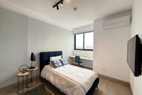 Image of bedroom with bed and television in this condo for sale in Balcony