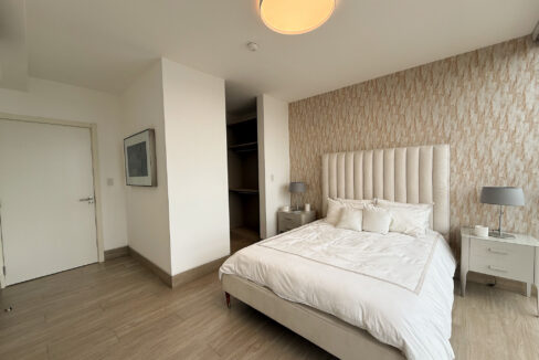 Image of bedroom with bed and table in this condo for sale in Balcony