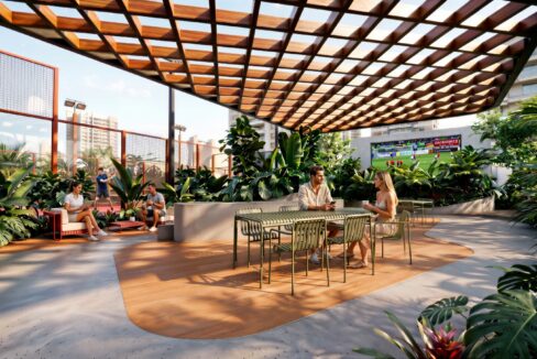 Covered social area with greenery and seating in Vibe