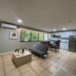 Image of living area with furniture in this condo for sale in Coronado Suites