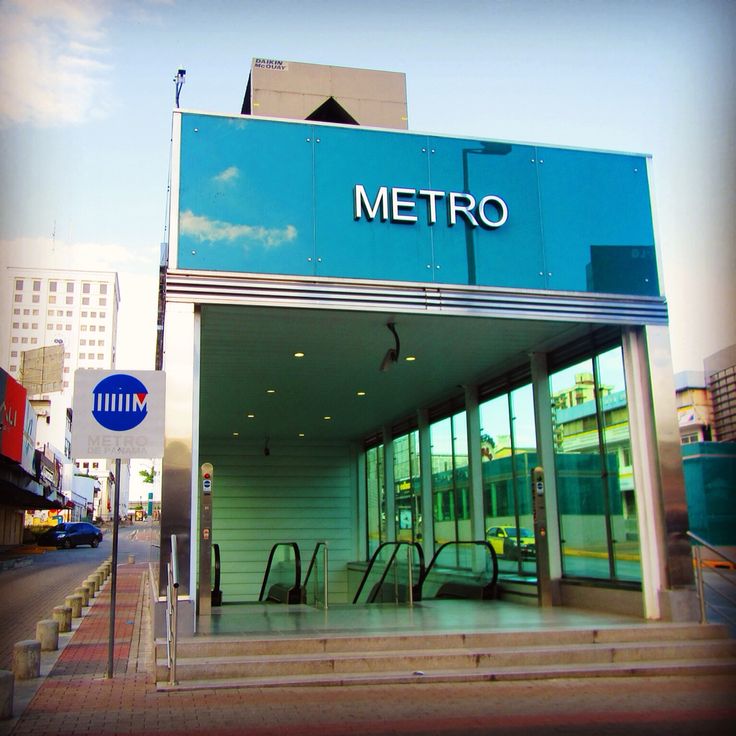 Modern Metro de Panamá subway entrance with glass walls and escalators in El Cangrejo Panama City real estate services by Panama Equity Real Estate