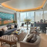 Image of main living area with furniture and ocean views in this condo for sale in P.H Peninsula
