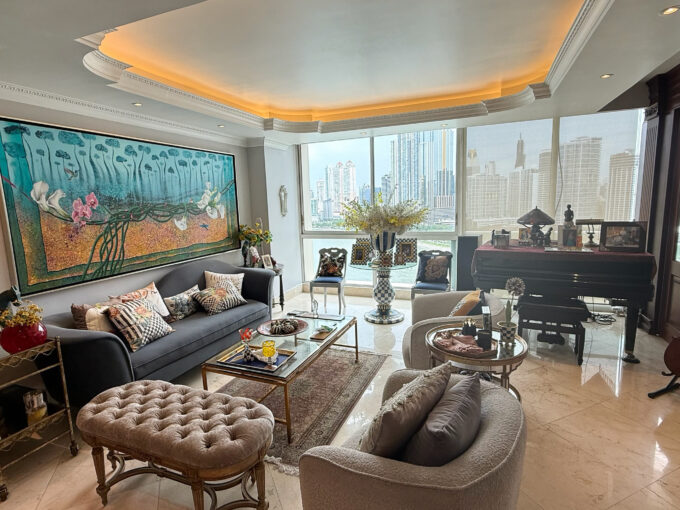Main living area with furniture and ocean views in this condo for sale in P.H Peninsula