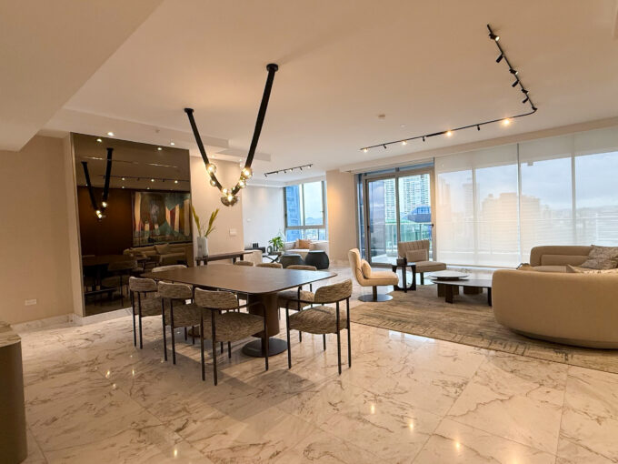 Stunning living room with marble floors and floor to ceiling in Regalia