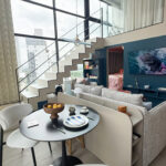 Large living space with furniture in this condo for sale in Dovle Selva