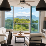 Large living room with furniture and balcony showing green views in this condo in Royal Palm