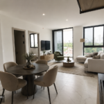 Model living and dining area with floor-to-ceiling windows in this NEXT Coco del Mar residence.