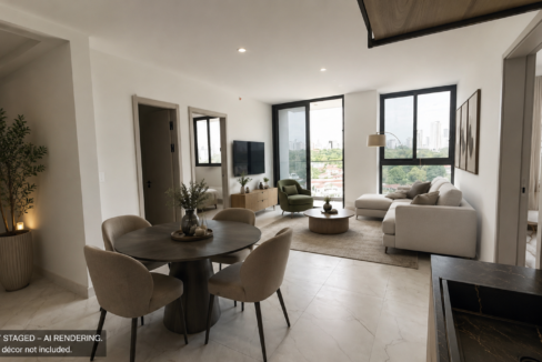 Model living and dining area with floor-to-ceiling windows in this NEXT Coco del Mar residence.