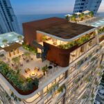 Aerial rendering of the Selvatica tower rooftop amenity deck with pools and gardens above the coastline.