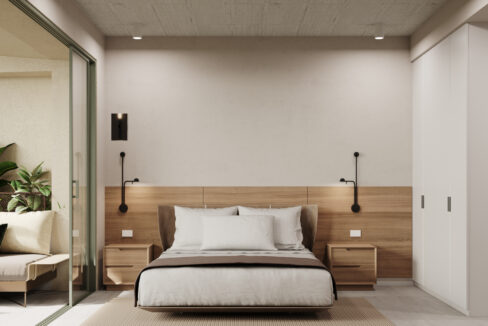 Bedroom and balcony in an A19 condo at Cincuentenario