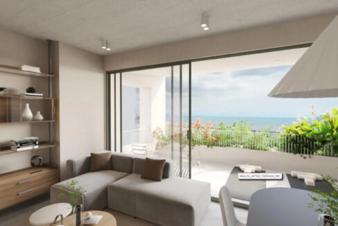 Living room with balcony view and furniture in this condo for sale in A19