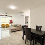 Living dining room with furniture in this condo for sale in Cangrejo 507
