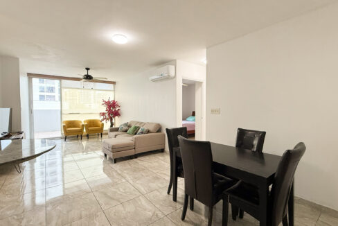 Living dining room with furniture in this condo for sale in Cangrejo 507