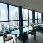 Living room with furniture in this condo for sale in Tribu