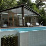 Front of a Taboga house for sale with infinity pool and deck